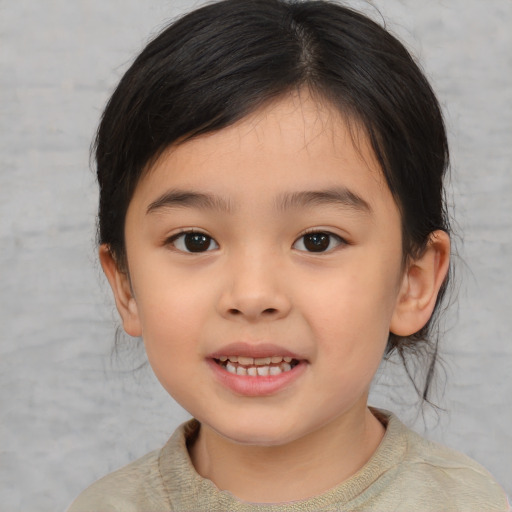 Joyful asian child female with medium  brown hair and brown eyes