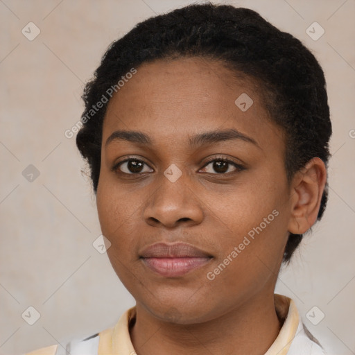 Joyful black young-adult female with short  brown hair and brown eyes