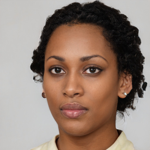 Neutral black young-adult female with long  black hair and brown eyes