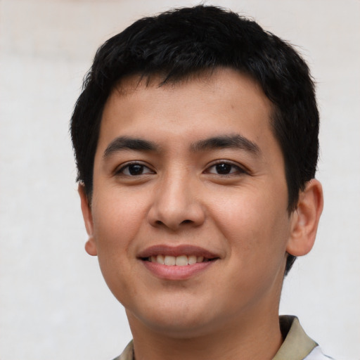 Joyful asian young-adult male with short  black hair and brown eyes