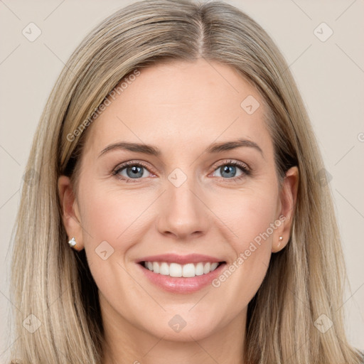 Joyful white young-adult female with long  brown hair and grey eyes