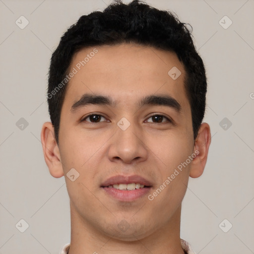 Joyful latino young-adult male with short  black hair and brown eyes