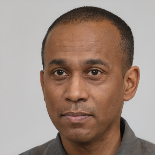 Neutral black adult male with short  black hair and brown eyes