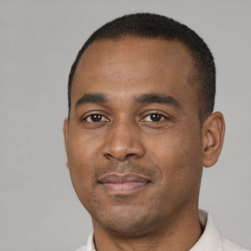 Neutral black young-adult male with short  black hair and brown eyes