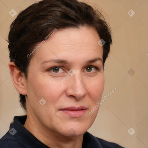 Joyful white adult female with short  brown hair and brown eyes