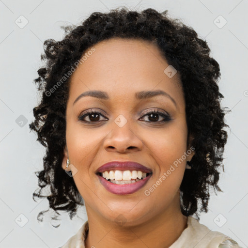 Joyful black young-adult female with medium  black hair and brown eyes