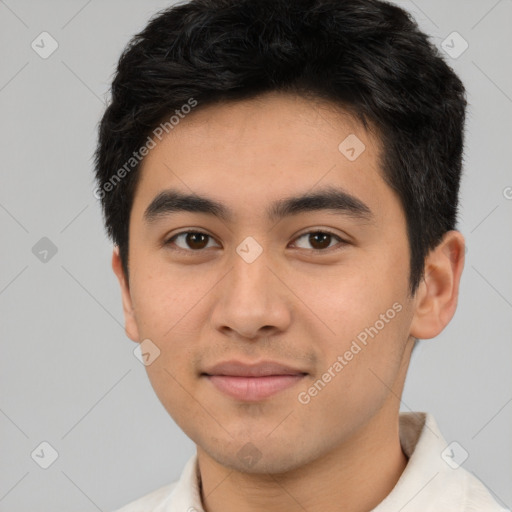 Joyful asian young-adult male with short  black hair and brown eyes