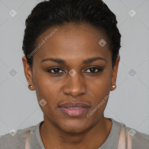 Joyful black young-adult female with short  black hair and brown eyes