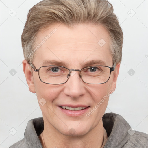 Joyful white adult male with short  brown hair and grey eyes