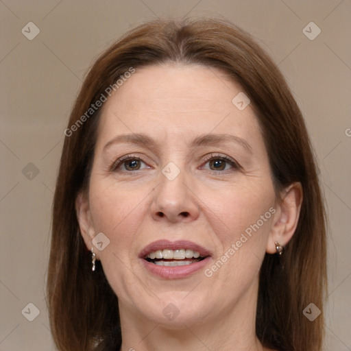 Joyful white adult female with medium  brown hair and brown eyes