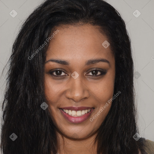 Joyful black young-adult female with long  brown hair and brown eyes