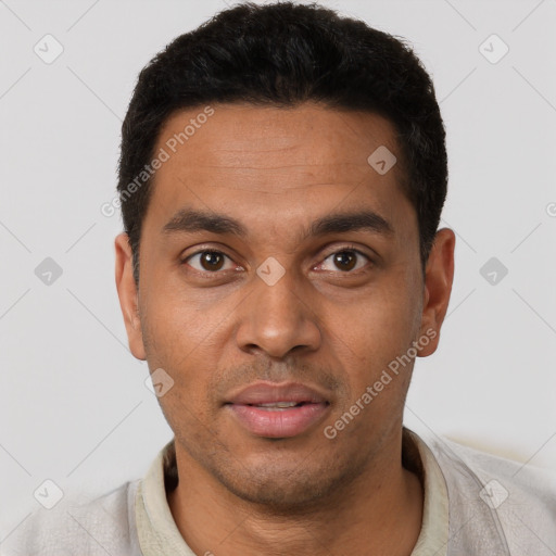 Neutral latino young-adult male with short  black hair and brown eyes