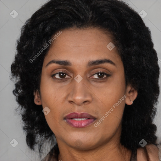Joyful latino young-adult female with long  black hair and brown eyes