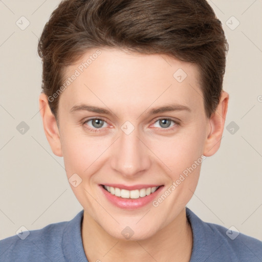 Joyful white young-adult female with short  brown hair and grey eyes