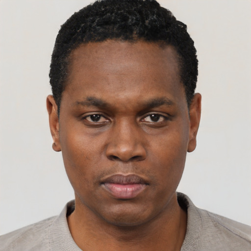 Neutral black young-adult male with short  black hair and brown eyes