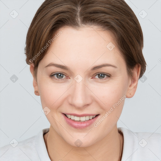 Joyful white young-adult female with short  brown hair and grey eyes