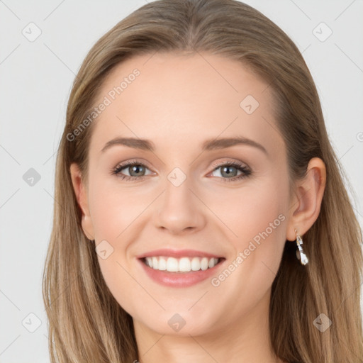 Joyful white young-adult female with long  brown hair and blue eyes