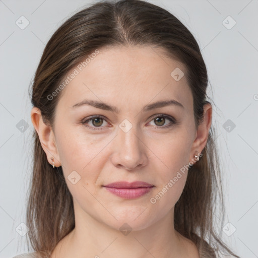 Joyful white young-adult female with medium  brown hair and grey eyes