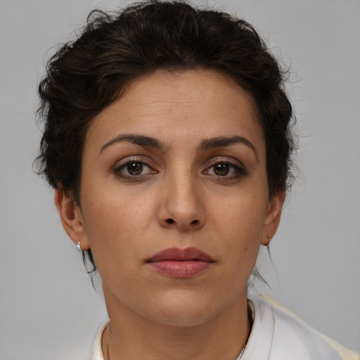 Neutral white young-adult female with short  brown hair and brown eyes