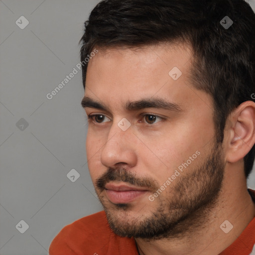 Neutral white young-adult male with short  black hair and brown eyes