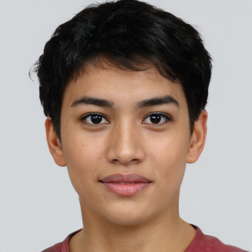 Joyful latino young-adult male with short  brown hair and brown eyes