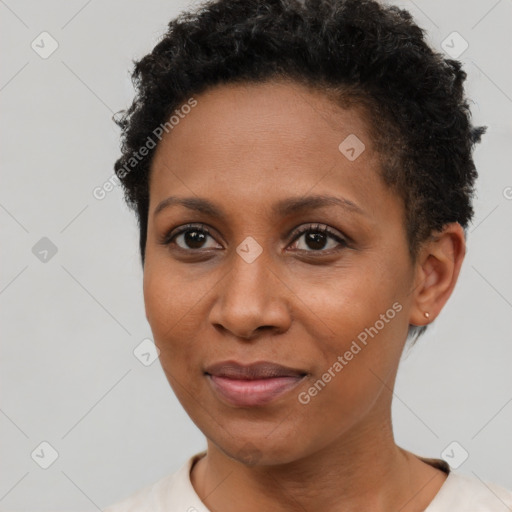 Joyful black adult female with short  brown hair and brown eyes