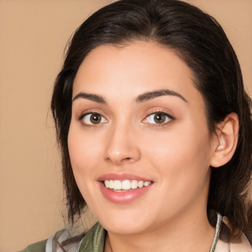 Joyful white young-adult female with medium  brown hair and brown eyes