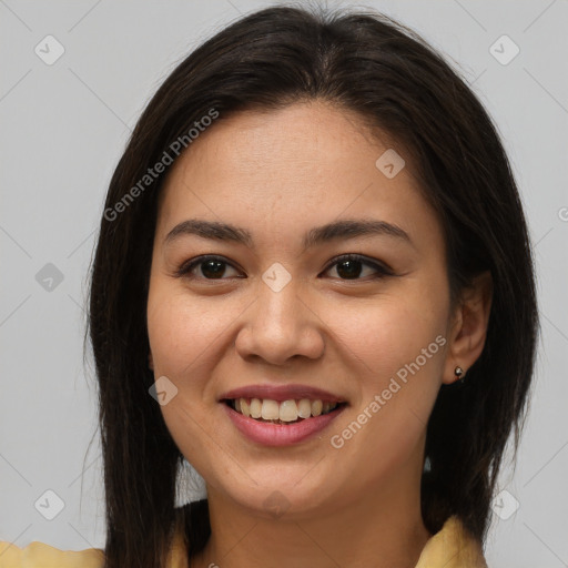 Joyful latino young-adult female with medium  brown hair and brown eyes