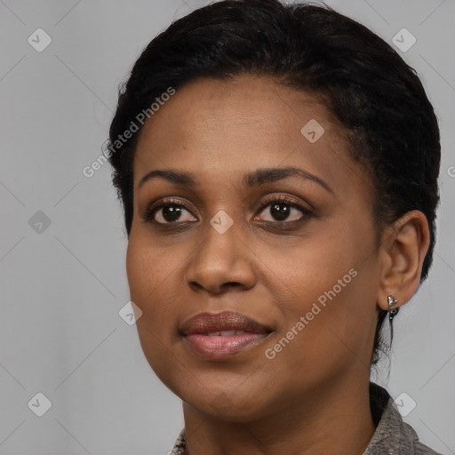 Joyful black young-adult female with medium  black hair and brown eyes