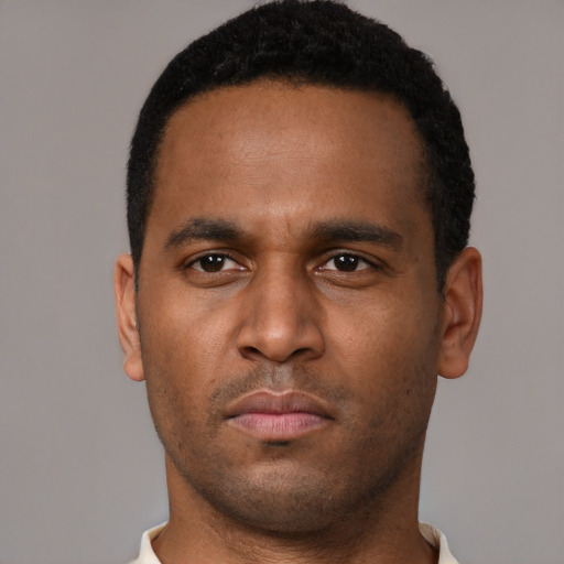 Neutral black young-adult male with short  brown hair and brown eyes