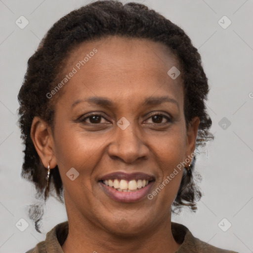 Joyful latino adult female with short  brown hair and brown eyes