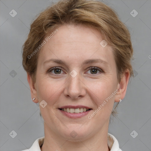 Joyful white adult female with short  brown hair and grey eyes