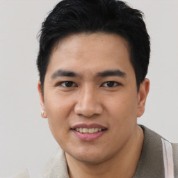 Joyful asian young-adult male with short  black hair and brown eyes