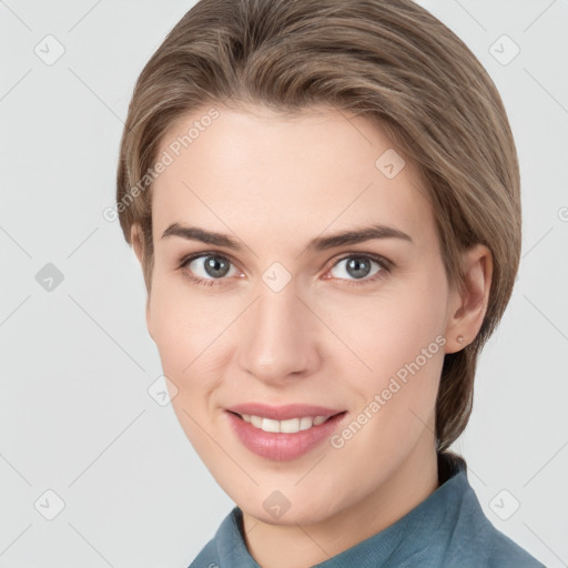 Joyful white young-adult female with medium  brown hair and grey eyes