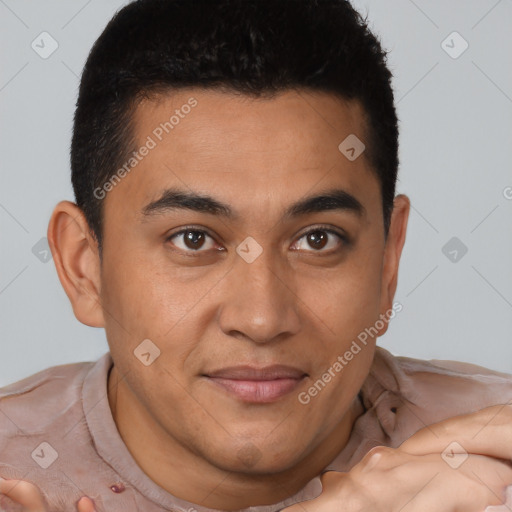 Joyful latino young-adult male with short  brown hair and brown eyes