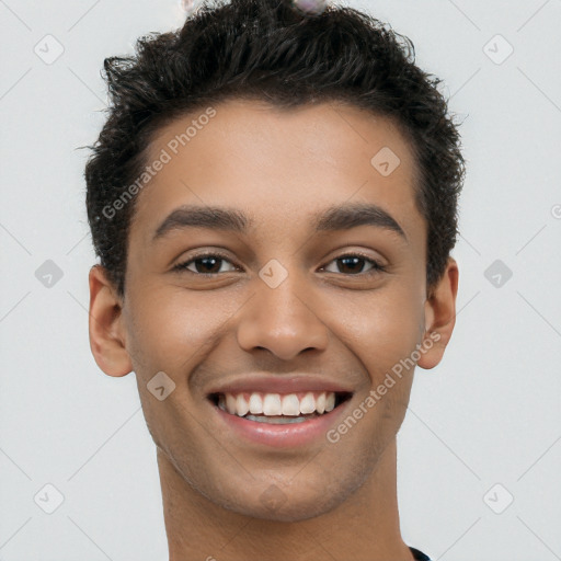 Joyful latino young-adult male with short  brown hair and brown eyes