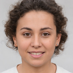 Joyful white young-adult female with medium  brown hair and brown eyes