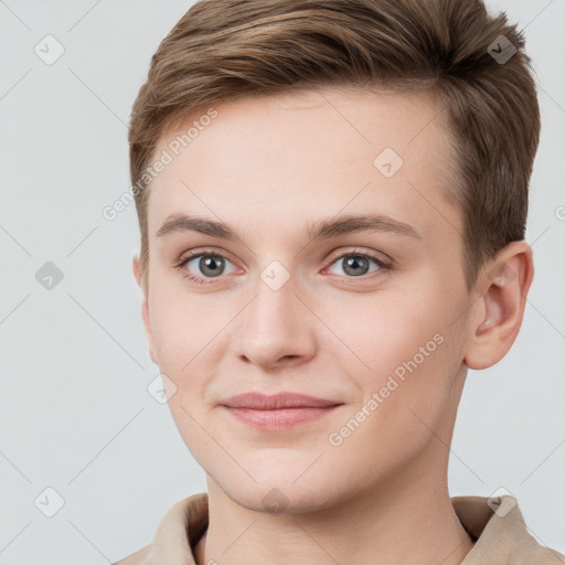 Joyful white young-adult female with short  brown hair and grey eyes