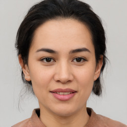 Joyful white young-adult female with medium  brown hair and brown eyes