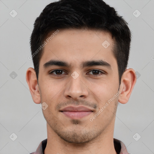 Joyful white young-adult male with short  black hair and brown eyes