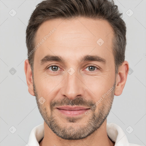 Joyful white adult male with short  brown hair and brown eyes