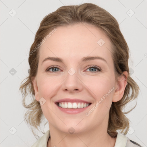 Joyful white young-adult female with medium  brown hair and blue eyes