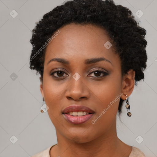 Joyful black young-adult female with short  black hair and brown eyes