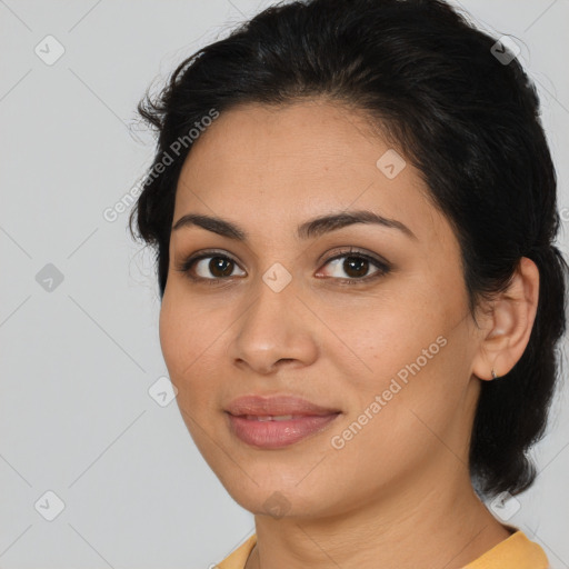 Joyful latino young-adult female with medium  brown hair and brown eyes