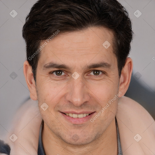 Joyful white adult male with short  brown hair and brown eyes