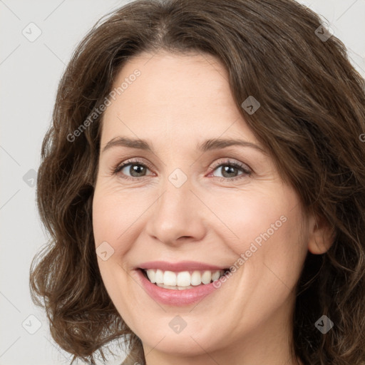 Joyful white young-adult female with medium  brown hair and green eyes