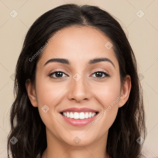 Joyful white young-adult female with long  black hair and brown eyes