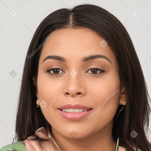 Joyful latino young-adult female with long  brown hair and brown eyes