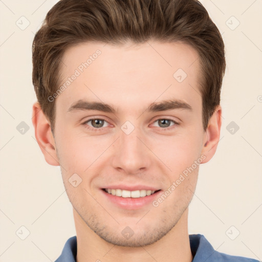 Joyful white young-adult male with short  brown hair and grey eyes