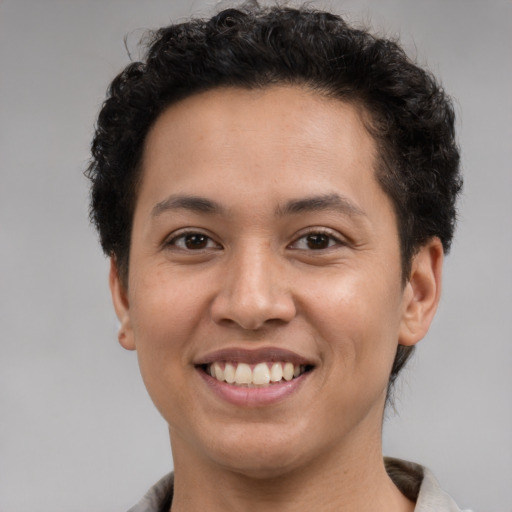 Joyful latino young-adult female with short  brown hair and brown eyes